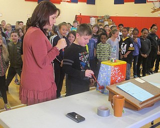 Neighbors | Zack Shively.Principal Lenton had the students who accomplished certain goals, such as perfect attendance, stand up to be recognized. After that, all the students at the event stood up and awaited to see what activity they would do. The contraption pictured was used to give a pencil with directions for the celebration on it.