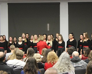 Neighbors | Abby Slanker.Canfield High School One Octave Higher choir, under the direction of Kelly Scurich, performed holiday songs at the Canfield library during the Rotary Club of Canfield’s annual Lighting of the Green on Dec. 1.