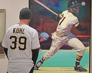 YOUNGSTOWN, OHIO - DECEMBER 7, 2017: Pittsburgh Pirates pitcher Chad Kuhl looks at a painting of Roberto Clemente inside of the sports room, Thursday morning at the Butler Institute of Art during the Pirates Care-A-Van tour. DAVID DERMER | THE VINDICATOR