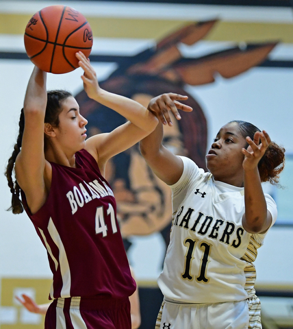 WARREN, OHIO - DECEMBER 7, 2017: Boardman's Katie Stamp protects the ball from Harding's Toni Donaldson during the first half of their game, Thursday night at Warren Harding High School. DAVID DERMER | THE VINDICATOR