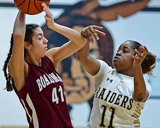 WARREN, OHIO - DECEMBER 7, 2017: Boardman's Katie Stamp protects the ball from Harding's Toni Donaldson during the first half of their game, Thursday night at Warren Harding High School. DAVID DERMER | THE VINDICATOR
