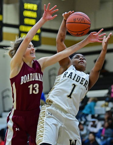 WARREN, OHIO - DECEMBER 7, 2017: Harding's XXX, right, and Boardman's Cate Green reach for a rebound during the first half of their game, Thursday night at Warren Harding High School. DAVID DERMER | THE VINDICATOR..No #1 on Harding roster.