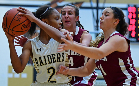 WARREN, OHIO - DECEMBER 7, 2017: Harding's Diamond Phillips looks to pressure the ball while being pressured by Boardman's Emma Tokarsky and Alicia Saxton during the first half of their game, Thursday night at Warren Harding High School. DAVID DERMER | THE VINDICATOR