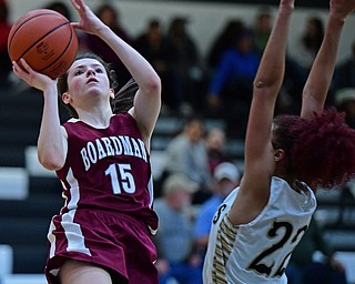 WARREN, OHIO - DECEMBER 7, 2017: Boardman's Raegan Burkey shoots over Harding's Faith Burch during the first half of their game, Thursday night at Warren Harding High School. DAVID DERMER | THE VINDICATOR