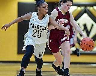 WARREN, OHIO - DECEMBER 7, 2017: Harding's Brayleonna Woods knocks the ball away from Boardman's Raegan Burkey during the first half of their game, Thursday night at Warren Harding High School. DAVID DERMER | THE VINDICATOR