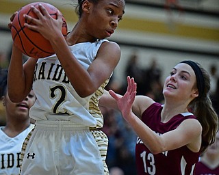 WARREN, OHIO - DECEMBER 7, 2017: Harding's Diamond Phillips grabs a rebound away from Boardman's Cate Green during the first half of their game, Thursday night at Warren Harding High School. DAVID DERMER | THE VINDICATOR