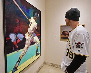 YOUNGSTOWN, OHIO - DECEMBER 7, 2017: Pittsburgh Pirates pitcher Chad Kuhl looks at a painting of Roberto Clemente inside of the sports room, Thursday morning at the Butler Institute of Art during the Pirates Care-A-Van tour. DAVID DERMER | THE VINDICATOR