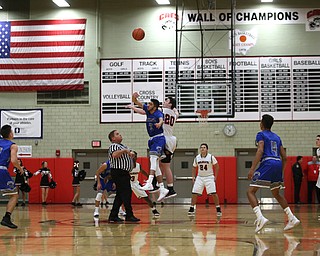 Hubbard's Bashar Rasoul (5) and Struthers' Ryan Leonard (20) go up for the tipoff in the first quarter of an AAC high school basketball game, Friday, Dec. 8, 2017, in Struthers. Hubbard won 70-55...(Nikos Frazier | The Vindicator)