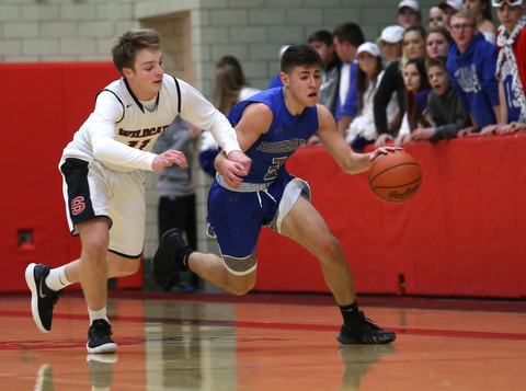 Hubbard's Cam Resatar (3) charges towards the net after stealing the ball from Struthers' Trey Metzka (11) in the second quarter of an AAC high school basketball game, Friday, Dec. 8, 2017, in Struthers. Hubbard won 70-55...(Nikos Frazier | The Vindicator)