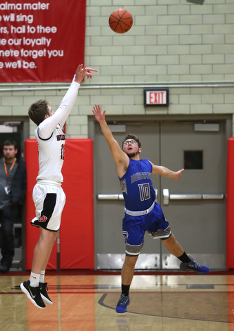 Hubbard's Zach Resatar (10) attempts to block Struthers' Trey Metzka (11) three point shot in the second quarter of an AAC high school basketball game, Friday, Dec. 8, 2017, in Struthers. Hubbard won 70-55...(Nikos Frazier | The Vindicator)