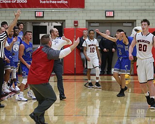 Both benches react after a basket in the third quarter of an AAC high school basketball game between Hubbard and Struthers High Schools, Friday, Dec. 8, 2017, in Struthers. Hubbard won 70-55...(Nikos Frazier | The Vindicator)