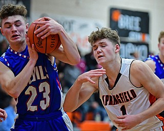NEW MIDDLETOWN, OHIO - DECEMBER 8, 2017: Western Reserve's Cole DeZee takes the ball away from Springfield's Evan Ohlin during the first half of their game, Friday night at Springfield High School. DAVID DERMER | THE VINDICATOR