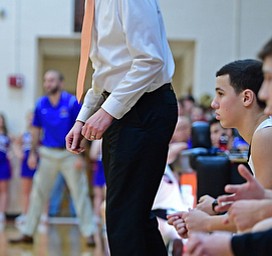 NEW MIDDLETOWN, OHIO - DECEMBER 8, 2017: Springfield head coach Steve French stands near the bench of their game, Friday night at Springfield High School. DAVID DERMER | THE VINDICATOR