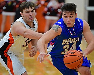 NEW MIDDLETOWN, OHIO - DECEMBER 8, 2017: Western Reserve's Jack Cappabianca drives on Springfield's Ben Chaszeyka during the 2nd half of their game, Friday night at Springfield High School. DAVID DERMER | THE VINDICATOR