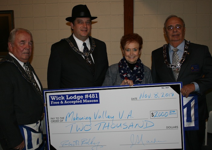 Wick Masonic Lodge 481 recently presented a $2,000 check to the Youngstown Veterans Administration. Officers of the Lodge presented the check to Lori Stone, volunteer coordinator for the Youngstown VA. Above, from left, are Jerry Carden, committee chairman; Dominic Lucarelli, Master of the Lodge; Stone; and Robert Rodkey, committee co-chairman.

