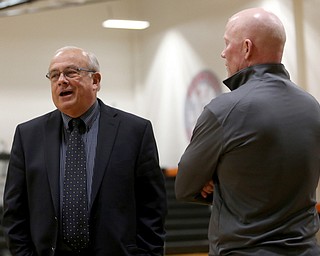 Columbiana head coach Ron Moschella and Mineral Ridge head coach Matthew Cluse talk before a high school basketball game, Saturday, Dec. 9, 2017, in Mineral Ridge. Columbiana won 70-32...(Nikos Frazier | The Vindicator)