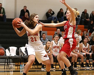 Columbiana's Alexis Cross (20) boxes out Mineral Ridge forward Noelle Bukovina (21) in the first quarter of a high school basketball game, Saturday, Dec. 9, 2017, in Mineral Ridge. Columbiana won 70-32...(Nikos Frazier | The Vindicator)