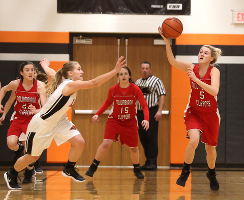 Columbiana's Tessa Liggett (5) steals the ball from Mineral Ridge guard Nevaeh Cruz (1) in the first quarter of a high school basketball game, Saturday, Dec. 9, 2017, in Mineral Ridge. Columbiana won 70-32...(Nikos Frazier | The Vindicator)