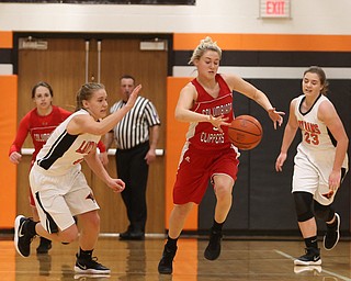 Columbiana's Tessa Liggett (5) steals the ball from Mineral Ridge guard Nevaeh Cruz (1) in the first quarter of a high school basketball game, Saturday, Dec. 9, 2017, in Mineral Ridge. Columbiana won 70-32...(Nikos Frazier | The Vindicator)