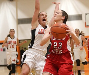 Columbiana's Taylor Hall (23) goes up for a layup against Mineral Ridge guard Nevaeh Cruz (1) in the first quarter of a high school basketball game, Saturday, Dec. 9, 2017, in Mineral Ridge. Columbiana won 70-32...(Nikos Frazier | The Vindicator)