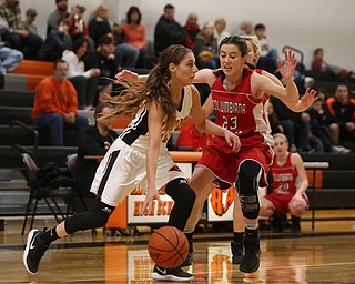 Mineral Ridge point guard Taryn Kolesar (10) goes up against Columbiana's Taylor Hall (23) in the first quarter of a high school basketball game, Saturday, Dec. 9, 2017, in Mineral Ridge. Columbiana won 70-32...(Nikos Frazier | The Vindicator)