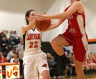 Columbiana's Tessa Liggett (5) goes up for a layup as Mineral Ridge forward Fran Kesner (22) attempts to grab the ball in the first quarter of a high school basketball game, Saturday, Dec. 9, 2017, in Mineral Ridge. Columbiana won 70-32...(Nikos Frazier | The Vindicator)