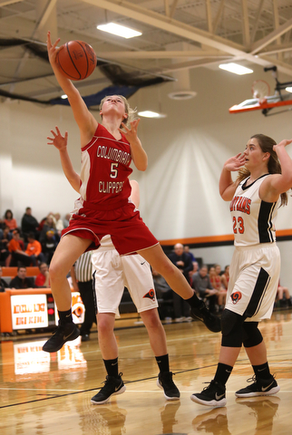 Columbiana's Tessa Liggett (5) looses control of the ball as she goes up for a layup in the first quarter of a high school basketball game, Saturday, Dec. 9, 2017, in Mineral Ridge. Columbiana won 70-32...(Nikos Frazier | The Vindicator)