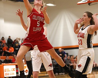 Columbiana's Tessa Liggett (5) looses control of the ball as she goes up for a layup in the first quarter of a high school basketball game, Saturday, Dec. 9, 2017, in Mineral Ridge. Columbiana won 70-32...(Nikos Frazier | The Vindicator)