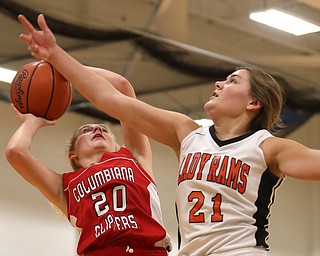 Mineral Ridge forward Noelle Bukovina (21) attempts to block Columbiana's Alexis Cross (20) shot in the first quarter of a high school basketball game, Saturday, Dec. 9, 2017, in Mineral Ridge. Columbiana won 70-32...(Nikos Frazier | The Vindicator)