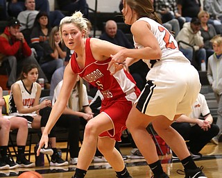 Columbiana's Tessa Liggett (5) pushes back Mineral Ridge forward Noelle Bukovina (21) in the first quarter of a high school basketball game, Saturday, Dec. 9, 2017, in Mineral Ridge. Columbiana won 70-32...(Nikos Frazier | The Vindicator)
