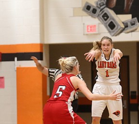 Mineral Ridge guard Nevaeh Cruz (1) passes the ball to a teammate over Columbiana's Tessa Liggett (5) in the second quarter of a high school basketball game, Saturday, Dec. 9, 2017, in Mineral Ridge. Columbiana won 70-32...(Nikos Frazier | The Vindicator)