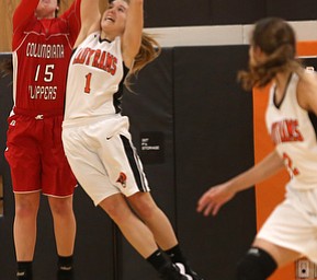 Columbiana's Kennedy Fullum (15) and Mineral Ridge guard Nevaeh Cruz (1) jump up for the rebound in the second quarter of a high school basketball game, Saturday, Dec. 9, 2017, in Mineral Ridge. Columbiana won 70-32...(Nikos Frazier | The Vindicator)