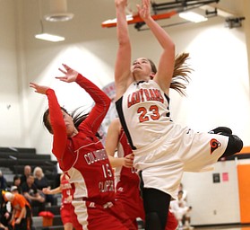 Mineral Ridge forward Alexa Harkins (23) goes up for a layup over Columbiana's Kennedy Fullum (15) in the second quarter of a high school basketball game, Saturday, Dec. 9, 2017, in Mineral Ridge. Columbiana won 70-32...(Nikos Frazier | The Vindicator)