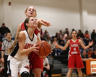 Mineral Ridge point guard Taryn Kolesar (10) looks up at the basket as Columbiana's Alexis Cross (20) attempts to block her shot in the third quarter of a high school basketball game, Saturday, Dec. 9, 2017, in Mineral Ridge. Columbiana won 70-32...(Nikos Frazier | The Vindicator)