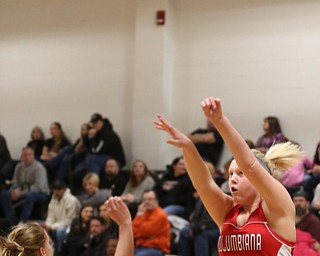 Columbiana's Marisa McDonough (14) goes up for two as Mineral Ridge guard Nevaeh Cruz (1) attempts to block her shot in the fourth quarter of a high school basketball game, Saturday, Dec. 9, 2017, in Mineral Ridge. Columbiana won 70-32...(Nikos Frazier | The Vindicator)