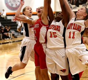 Mineral Ridge point guard Danielle Aulet (5), Columbiana's Grace Hammond (10), Mineral Ridge forward Kassidy Weimer (15) and /m11/ fight for the rebound in the fourth quarter of a high school basketball game, Saturday, Dec. 9, 2017, in Mineral Ridge. Columbiana won 70-32...(Nikos Frazier | The Vindicator)