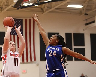 Girard's Sophia Strollo (11) goes up for two as Hubbard's Destiny Watson (24) attempts to block her shot in the second quarter of an AAC high school basketball game against TEAM, Monday, Dec. 11, 2017, in Girard. Girard won 39-23...(Nikos Frazier | The Vindicator)