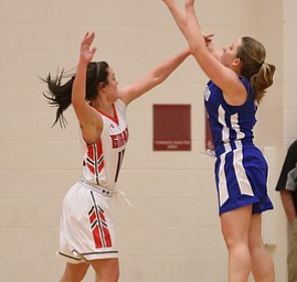 Hubbard's Ruthie Sandberg (3) goes up for three as Hubbard's Megan Learn (14) attempts to block her shot in the second quarter of an AAC high school basketball game against TEAM, Monday, Dec. 11, 2017, in Girard. Girard won 39-23...(Nikos Frazier | The Vindicator)