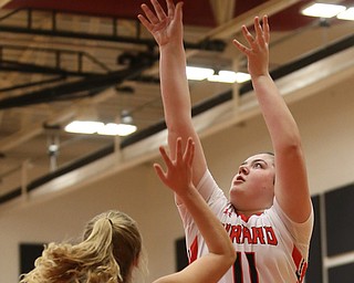 Girard's Sophia Strollo (11) goes up for a layup over Hubbard's Hannah Kist (4) in the third quarter of an AAC high school basketball game, Monday, Dec. 11, 2017, in Girard. Girard won 39-23...(Nikos Frazier | The Vindicator)