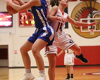 Hubbard's Hannah Kist (4) and Girard's Lindsay Cave (14) go up for the rebound in the third quarter of an AAC high school basketball game, Monday, Dec. 11, 2017, in Girard. Girard won 39-23...(Nikos Frazier | The Vindicator)