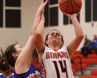 Girard's Lindsay Cave (14) goes up for a layup but is blocked by Hubbard's Calley Tingler (32) in the fourth quarter of an AAC high school basketball game, Monday, Dec. 11, 2017, in Girard. Girard won 39-23...(Nikos Frazier | The Vindicator)