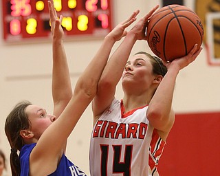 Girard's Lindsay Cave (14) goes up for a layup in the fourth quarter of an AAC high school basketball game, Monday, Dec. 11, 2017, in Girard. Girard won 39-23...(Nikos Frazier | The Vindicator)