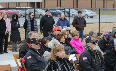   ROBERT K YOSAY  | THE VINDICATOR..the crowd listens to the ceremony.  Lordstown Veterans Memorial Stadium dedication.: Lordstown HS new track and soccer field. ..-30-