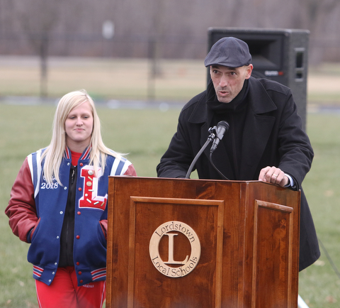   ROBERT K YOSAY  | THE VINDICATOR..Soccer coach Coach Matt Kresic.   and Senior Corine Eastham..  thank everyone... for their supper..  Lordstown Veterans Memorial Stadium dedication.: Lordstown HS new track and soccer field. ..-30-