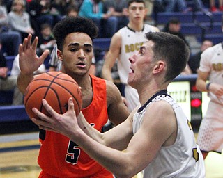 William D. Lewis The Vindictor  Lowellville's Dylan Durkin(34)) goes for 2 past Ridge's Jarred Miller(5) during 12-12-17 action at Lowellville.
