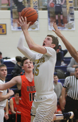 William D. Lewis The Vindictor  Lowellville's Jake Rotz(15) goes for 2 past Ridge's Kody Zupko(10) during 12-12-17 action at Lowellville.
