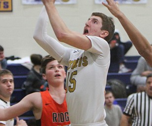William D. Lewis The Vindictor  Lowellville's Jake Rotz(15) goes for 2 past Ridge's Kody Zupko(10) during 12-12-17 action at Lowellville.