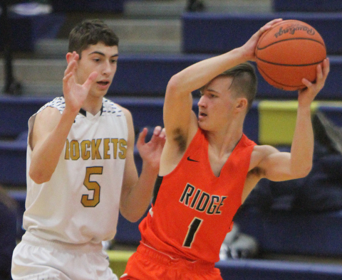 William D. Lewis The Vindictor  Lowellville'sAlex Mamula-Zarlingo(5) defends gainst Ridge's Austin Govenor(1) during 12-12-17 action at Lowellville.