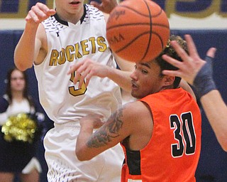 William D. Lewis The Vindictor  Lowellville's Alex Mamula-Zarlingo (5) passes the ball fover Ridge'sDonavin Stull(30) during 12-12-17 action at Lowellville.