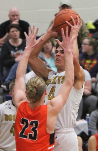 William D. Lewis The Vindictor  Lowellville's Joe Ballone(24) ) shoots over Ridge'sT Jordan Zupko(23) during 12-12-17 action at Lowellville.